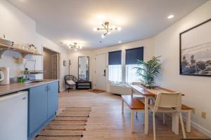 a kitchen and dining room with a table and a dining room at Urban Nest, 1-BDRM Apt, Ground Floor in Halifax