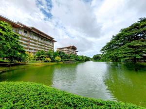 a river with buildings in the middle of it at Miranda B 306 1BR at Pico de Loro by Raquel's Place in Nasugbu