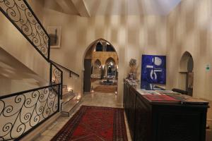 a hallway with a staircase and a stair case at Atlas Widan in Marrakech