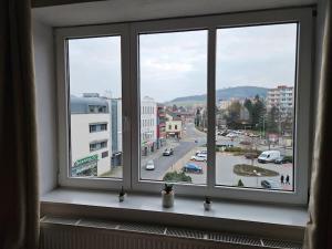 a window with a view of a city street at Prostorný byt 3+1 pro 4 osob Možnost přistýlky+2os in Šumperk
