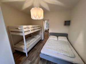 Posteľ alebo postele v izbe v ubytovaní Appartement 4 personnes, wifi, proche centre et thermes