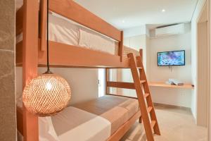 a bunk bed in a room with a pendant light at Acacia - Explore your senses in Preveza