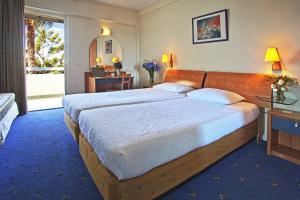 a bedroom with a large bed in a room at Congo Palace in Athens