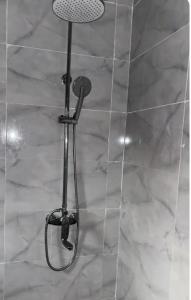 a shower with a shower head in a bathroom at Heda House in Sanyang +31 photos