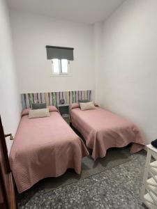Posteľ alebo postele v izbe v ubytovaní Apartamentos "Un Rico Domingo", Parking solo planta baja