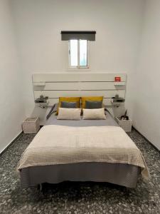 Posteľ alebo postele v izbe v ubytovaní Apartamentos "Un Rico Domingo", Parking solo planta baja