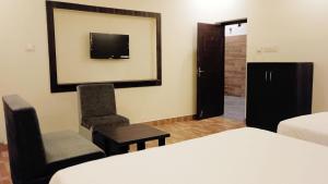 Voodi või voodid majutusasutuse R Hotels By Suraj Residency Yercaud toas