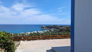 a view of the ocean from a house at KIRA'S RESIDENCE PANORAMIC VIEW in Archangelos