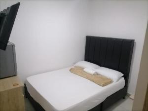 מיטה או מיטות בחדר ב-Hostel HA