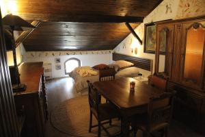 a room with a bedroom and a table and a bed at Mini Hotel-Bohemi in Plovdiv