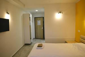 a hotel room with a bed and a door at B&B Boutique Eluize in Dubrovnik