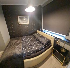 Tempat tidur dalam kamar di Apartament Nova Parkowa Szczecin Polska