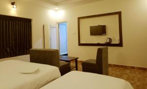 Voodi või voodid majutusasutuse R Hotels By Suraj Residency Yercaud toas