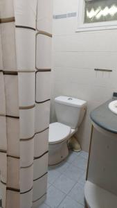 a bathroom with a toilet and a sink at יחידה במקום שקט ליד פארק הקישון in Qiryat H̱aroshet