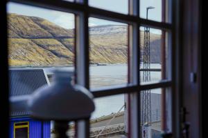 a view of a bridge from a window at Lovely 4 Bedroom House in Vestmanna in Vestmanna