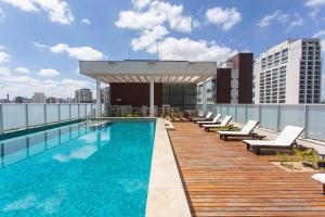 a swimming pool on the roof of a building at ADD Berrini in Sao Paulo