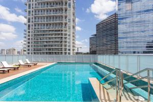 a swimming pool on the roof of a building at ADD Berrini in Sao Paulo