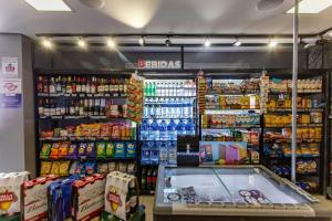 a grocery store aisle with drinks and other food at ADD Berrini in Sao Paulo