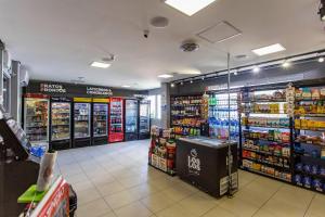 a store aisle of a grocery store with drinks at ADD Berrini in Sao Paulo