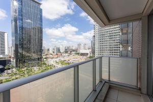 a balcony with a view of a city at ADD Berrini in Sao Paulo