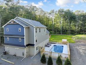 an aerial view of a house with a swimming pool at Dulce Retreat in Blakeslee