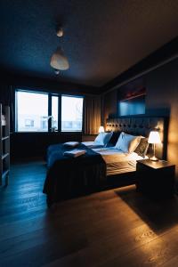 a bedroom with a large bed and a window at Brim Hotel in Reykjavík