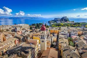 an aerial view of a city with a clock tower at Mouragia Budget Places in Corfu Town
