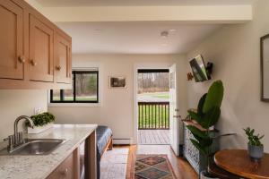 a kitchen with a sink and a counter top at The Willow, Catskill in Catskill