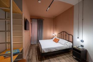 En eller flere senge i et værelse på RB Suites Napoli