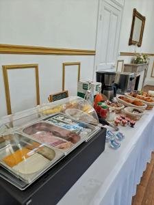 a table with many different types of food on it at Château des Aulnes 