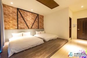 Cama o camas de una habitación en 墾丁去旅行旅店