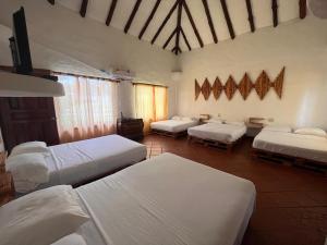 Un pat sau paturi într-o cameră la Mia Nueva Gorgona