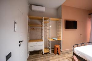 En eller flere senge i et værelse på RB Suites Napoli