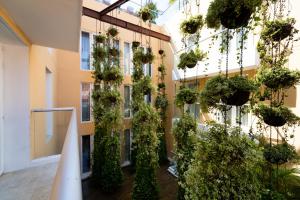 a building with plants on the side of it at Nacar Hotel Cartagena, Curio Collection by Hilton in Cartagena de Indias