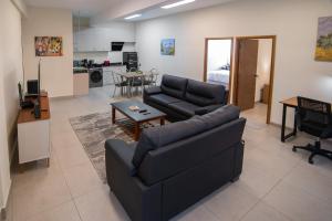 a living room with a couch and a table at Kawsay Apart in La Paz