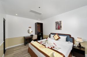 Harry Phu Quoc Hotel 3 tesisinde bir odada yatak veya yataklar