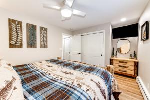 a bedroom with a bed and a ceiling fan at Estes Park Vacation Rental 1 Mi to National Park in Estes Park