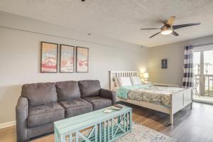 a living room with a couch and a bed at Ocean City Studio - Steps to Boardwalk and Beach! in Ocean City