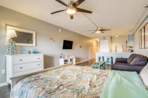 a bedroom with a large bed and a couch at Ocean City Studio - Steps to Boardwalk and Beach! in Ocean City