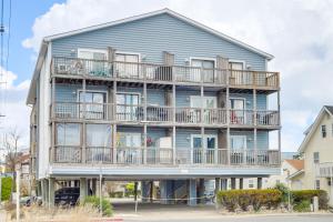 a large blue house with balconies on it at Ocean City Studio - Steps to Boardwalk and Beach! in Ocean City