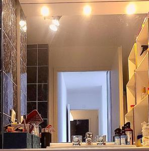 a kitchen with a large mirror and a counter top at Cozy Room with Private Bathroom near Paris LaDefense Arena in Courbevoie +30 photos