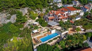 an aerial view of a house with a swimming pool at Villa Silversea in Hvar infinity heated pool in Hvar