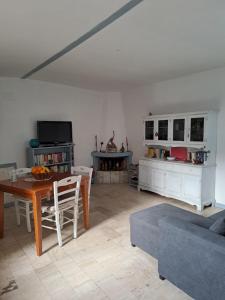 a living room with a table and a couch at Casa Susy in Rome +4 photos