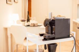 a coffee maker on a shelf in a kitchen at Appartement in Winningen mit Terrasse in Winningen