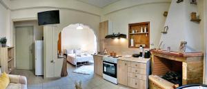 a kitchen with a stove top oven in a room at Spacious Apartment in Mytilene in Mytilini