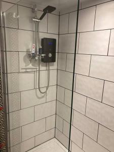a shower with a soap dispenser in a bathroom at Leven's Rest - 2 Bed Maisonette in Backbarrow