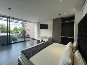 Postel nebo postele na pokoji v ubytování Hotel 47 Medellin Center
