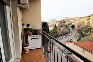 an apartment balcony with a view of a city at Darma Parla di Mare in Trieste