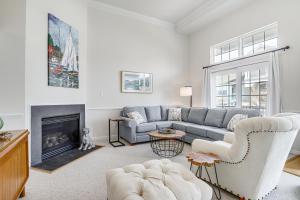 a living room with a couch and a fireplace at Shared Pool and Bay Access Ocean View Retreat in Ocean View