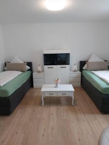 Postel nebo postele na pokoji v ubytování Ferienwohnung Schwabenstuben + 13 fotografií